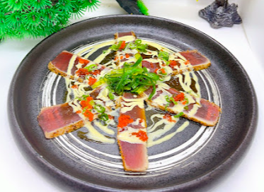 Kanpachi Sushi signature dishes Hamachi Kama
Yellowtail Jalapeño
Sashimi Deluxe